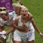 
              England's Chloe Kelly, centre, celebrates with teammates after scoring her side's second goal during the Women's Euro 2022 final soccer match between England and Germany at Wembley stadium in London, Sunday, July 31, 2022. (AP Photo/Rui Vieira)
            