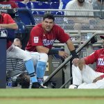 
              Miami Marlins' Billy Hamilton, left, Avisail Garcia, center, and Jesus Aguilar watch from the dugout during the ninth inning of the team's baseball game against the Philadelphia Phillies, Saturday, July 16, 2022, in Miami. The Phillies won 10-0. (AP Photo/Lynne Sladky)
            