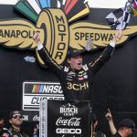 
              Tyler Reddick celebrates after winning a NASCAR Cup Series auto race at Indianapolis Motor Speedway, Sunday, July 31, 2022, in Indianapolis. (AP Photo/Darron Cummings)
            