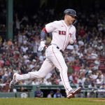 
              Boston Red Sox's Trevor Story runs toward first after hitting a solo home run against the Tampa Bay Rays during the second inning of a baseball game at Fenway Park, Tuesday, July 5, 2022, in Boston. (AP Photo/Mary Schwalm)
            