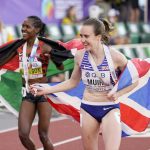
              Gold medalist Faith Kipyegon, of Kenya, letf, and bronze medalist Laura Muir, of Britain, celebrates after the women's 1500-meter run the at the World Athletics Championships on Monday, July 18, 2022, in Eugene, Ore. (AP Photo/Charlie Riedel)
            