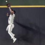 
              Milwaukee Brewers' Tyrone Taylor makes a leaping catch on a ball hit by Colorado Rockies' C.J. Cron during the fifth inning of a baseball game Monday, July 25, 2022, in Milwaukee. (AP Photo/Morry Gash)
            