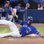 
              Toronto Blue Jays' Lourdes Gurriel Jr. scores against the Detroit Tigers on a single by Raimel Tapia during the fourth inning of a baseball game Friday, July 29, 2022, in Toronto. (Jon Blacker/The Canadian Press via AP)
            