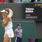 
              Germany's Tatjana Maria celebrates defeating Germany's Jule Niemeier in a women's singles quarterfinal match at the Wimbledon tennis championships in London, Tuesday July 5, 2022. (AP Photo/Kirsty Wigglesworth)
            