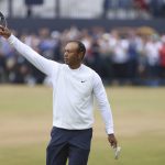 
              Tiger Woods of the US gestures at the end of his second round of the British Open golf championship on the Old Course at St. Andrews, Scotland, Friday July 15, 2022. The Open Championship returns to the home of golf on July 14-17, 2022, to celebrate the 150th edition of the sport's oldest championship, which dates to 1860 and was first played at St. Andrews in 1873. (AP Photo/Peter Morrison)
            