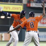 
              Houston Astros' Yordan Alverez celebrates with third base coach Gary Pettis after hitting a solo home run off New York Yankees starting pitcher Domingo German during the first inning in the second game of a baseball doubleheader Thursday, July 21, 2022, in Houston. (AP Photo/Kevin M. Cox)
            