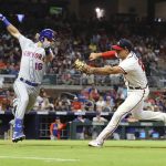 
              Atlanta Braves first baseman Matt Olson plays the ground ball by New York Mets Travis Jankowski and makes the tag for the out at first base during the sixth inning of a baseball game on Tuesday, July 12, 2022, in Atlanta. (Curtis Compton/Atlanta Journal-Constitution via AP)
            