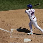 
              New York Mets' Eduardo Escobar hits a two-run home run during the fourth inning of a baseball game against the Texas Rangers on Sunday, July 3, 2022, in New York. (AP Photo/Adam Hunger)
            