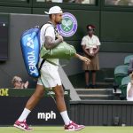 
              Australia's Nick Kyrgios walks on court wearing red shoes for his fourth round men's singles match against Brandon Nakashima of the United States on day eight of the Wimbledon tennis championships in London, Monday, July 4, 2022. After winning his match, Kyrgios traded in his all-white grass-court shoes for a red-and-white pair of sneakers, and replaced his white hat with a red one, before being interviewed on Centre Court. Big deal? Not to Kyrgios. To a reporter who peppered him with questions about it, though, sure seemed to be. That's because the All England Club has a rather strict policy about all-white attire while on match courts during the tournament -- something that some players think was better suited to the 1880s than the 2020s, while others appreciate as part of the charm of the oldest Grand Slam event in tennis. (AP Photo/Alberto Pezzali)
            