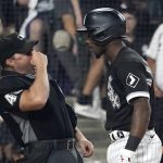 
              Home plate umpire Nick Mahrley reacts after Chicago White Sox's Tim Anderson made contact with Mahrley during the seventh inning of a baseball game Friday, July 29, 2022, in Chicago. Anderson was ejected. (AP Photo/Charles Rex Arbogast)
            