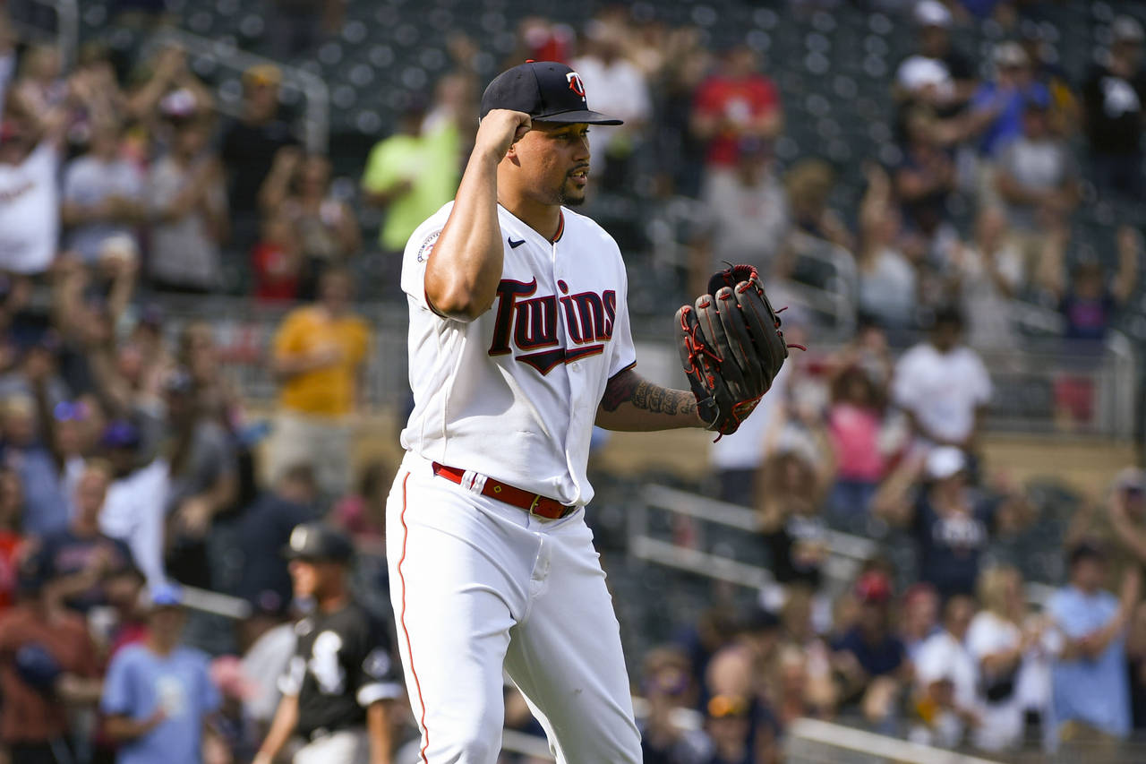 Minnesota Twins pitcher Jhoan Duran pumps his fist in celebration after the final out defeating the...