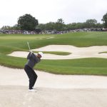 
              U.S golfer Tiger Woods plays out of the bunker on the 5th hole during the JP McManus Pro-Am at Adare Manor, Ireland, Tuesday, July, 5, 2022. (AP Photo/Peter Morrison)
            