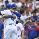
              Chicago Cubs' Willson Contreras, rear, hugs teammate Ian Happ (8) after defeating the Pittsburgh Pirates 4-2 in a baseball game Tuesday, July 26, 2022, in Chicago. (AP Photo/Paul Beaty)
            