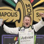 
              AJ Allmendinger celebrates after winning a NASCAR Xfinity Series auto race at Indianapolis Motor Speedway, Saturday, July 30, 2022, in Indianapolis. (AP Photo/Darron Cummings)
            