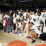 
              The Las Vegas Aces, with team owner Mark Davis, left, pose for a team photo after defeating the Chicago Sky in the WNBA Commissioner's Cup basketball game Tuesday, July 26, 2022, in Chicago. The Aces won 93-83. (AP Photo/Charles Rex Arbogast)
            