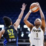 
              Indiana Fever forward NaLyssa Smith (1) shoots over Dallas Wings guard Tyasha Harris (52) in the first half of a WNBA basketball game in Indianapolis, Sunday, July 24, 2022. (AP Photo/Michael Conroy)
            