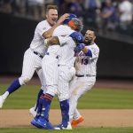 
              From left, New York Mets first baseman Pete Alonso, center fielder Brandon Nimmo, shortstop Francisco Lindor, and second baseman Luis Guillorme (13) celebrate after closing the tenth inning of a baseball game against the Miami Marlins, Saturday, July 9, 2022, in New York. (AP Photo/John Minchillo)
            