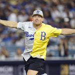 
              Professional wrestler and actor The Miz celebrates after hitting a home run during the MLB All Star Celebrity Softball game, Saturday, July 16, 2022, in Los Angeles. (AP Photo/Abbie Parr)
            