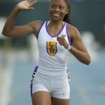 
              FILE - Allyson Felix of Los Angeles Baptist High School salutes the crowd after running 22.52 seconds in the 200 meters to break Marion Jones' state record of 22.71 in the CIF State track and field championships at Cerritos College in Norwalk, Calif., on Saturday, June 7, 2003. Her 18 medals are the most in world-championship history. She's looking forward to a slower pace to life. That includes running her own shoe company, being a voice for women's rights and taking her daughter to soccer practice. (Kirby Lee/The Daily Times Call via AP, FIle)
            