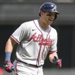 
              Atlanta Braves' Austin Riley rounds third base after hitting a solo home run during the second inning of a baseball game against the Cincinnati Reds, Saturday, July 2, 2022, in Cincinnati. (AP Photo/Jeff Dean)
            