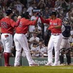 
              Boston Red Sox's Rafael Devers is congratulated by Franchy Cordero (16) and Kevin Plawecki after Devers hit a three-run home run against the New York Yankees during the fifth inning of a baseball game at Fenway Park, Thursday, July 7, 2022, in Boston. (AP Photo/Mary Schwalm)
            