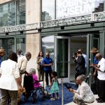 
              CORRECTS MONTH TO JULY, NOT JUNE -  Rachel Robinson, wife of Jackie Robinson, enters the newly-opened Jackie Robinson Museum, Tuesday, July 26, 2022, in New York. (AP Photo/Julia Nikhinson)
            