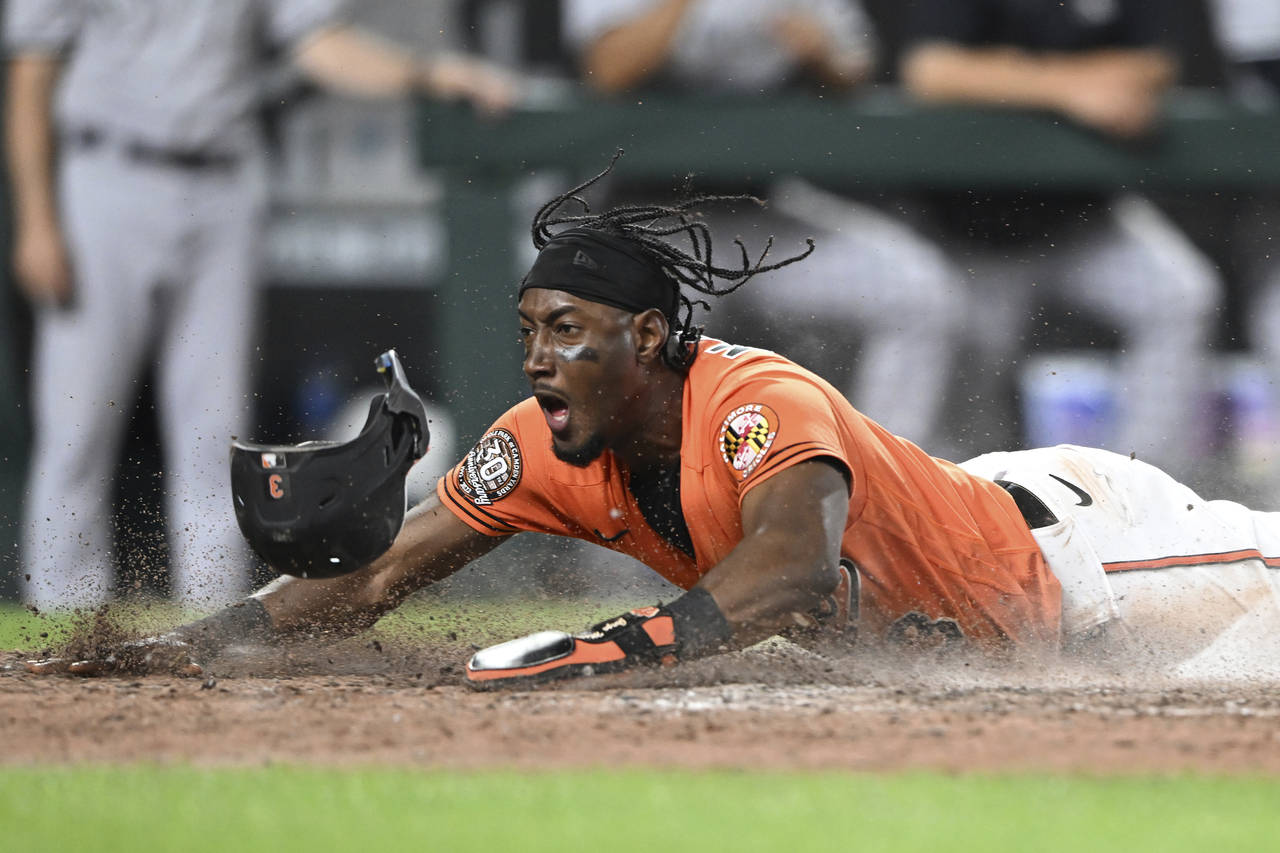 Baltimore Orioles' Jorge Mateo scores against the New York Yankees on a sacrifice fly by Cedric Mul...