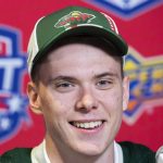 
              Danila Yurov speaks during a news conference after being selected by the Minnesota Wild during the first round of the NHL hockey draft in Montreal on Thursday, July 7, 2022. (Graham Hughes/The Canadian Press via AP)
            