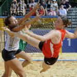 
              German beach handball player Michelle Schaffer shoots against American defender Isabelle Gosar at The World Games in Birmingham, Ala., on Wednesday, July 13, 2022. The 11-day, Olympic-style competition is being held in the United States for only the second time, at venues throughout Birmingham, Ala. (AP Photo/Jay Reeves)
            