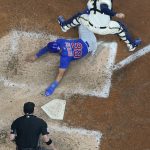 
              Chicago Cubs' Rafael Ortega slides safely past Milwaukee Brewers catcher Victor Caratini as he steals home during the sixth inning of a baseball game Tuesday, July 5, 2022, in Milwaukee. (AP Photo/Morry Gash)
            