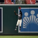 
              Washington Nationals center fielder Victor Robles leaps up to make a catch on a fly ball by Atlanta Braves' Austin Riley during the fifth inning of a baseball game, Saturday, July 16, 2022, in Washington. (AP Photo/Nick Wass)
            