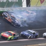 
              NASCAR Cup Series driver Joey Logano (22) crashes with Kyle Busch (18), Martin Truex Jr. (19) and Ross Chastain (1) during NASCAR Cup Series auto race at Atlanta Motor Speedway, Sunday, July 10, 2022, in Hampton, Ga. (AP Photo/Greg McWilliams)
            
