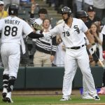 
              Chicago White Sox's Luis Robert (88) celebrates with Jose Abreu (79) after hitting a two-run home run during the first inning of the team's baseball game against the Detroit Tigers on Friday, July 8, 2022, in Chicago. (AP Photo/Paul Beaty)
            