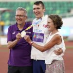 
              Geoff and Susan Wightman pose with their son Gold medalist Jake Wightman after the men's 1500-meter final run at the World Athletics Championships on Tuesday, July 19, 2022, in Eugene, Ore. (AP Photo/Ashley Landis)
            