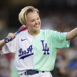
              Jojo Siwa gestures on the field during the MLB All Star Celebrity Softball game, Saturday, July 16, 2022, in Los Angeles. (AP Photo/Abbie Parr)
            