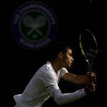 
              Spain's Carlos Alcaraz returns the ball to Germany's Oscar Otte in a men's singles match on day five of the Wimbledon tennis championships in London, Friday, July 1, 2022. (AP Photo/Alastair Grant)
            
