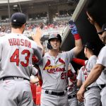 
              St. Louis Cardinals' Corey Dickerson (25) celebrates his three-run home run with Albert Pujols, right, Dakota Hudson (43) and others during the fourth inning of a baseball game against the Washington Nationals, Sunday, July 31, 2022, in Washington. (AP Photo/Nick Wass)
            