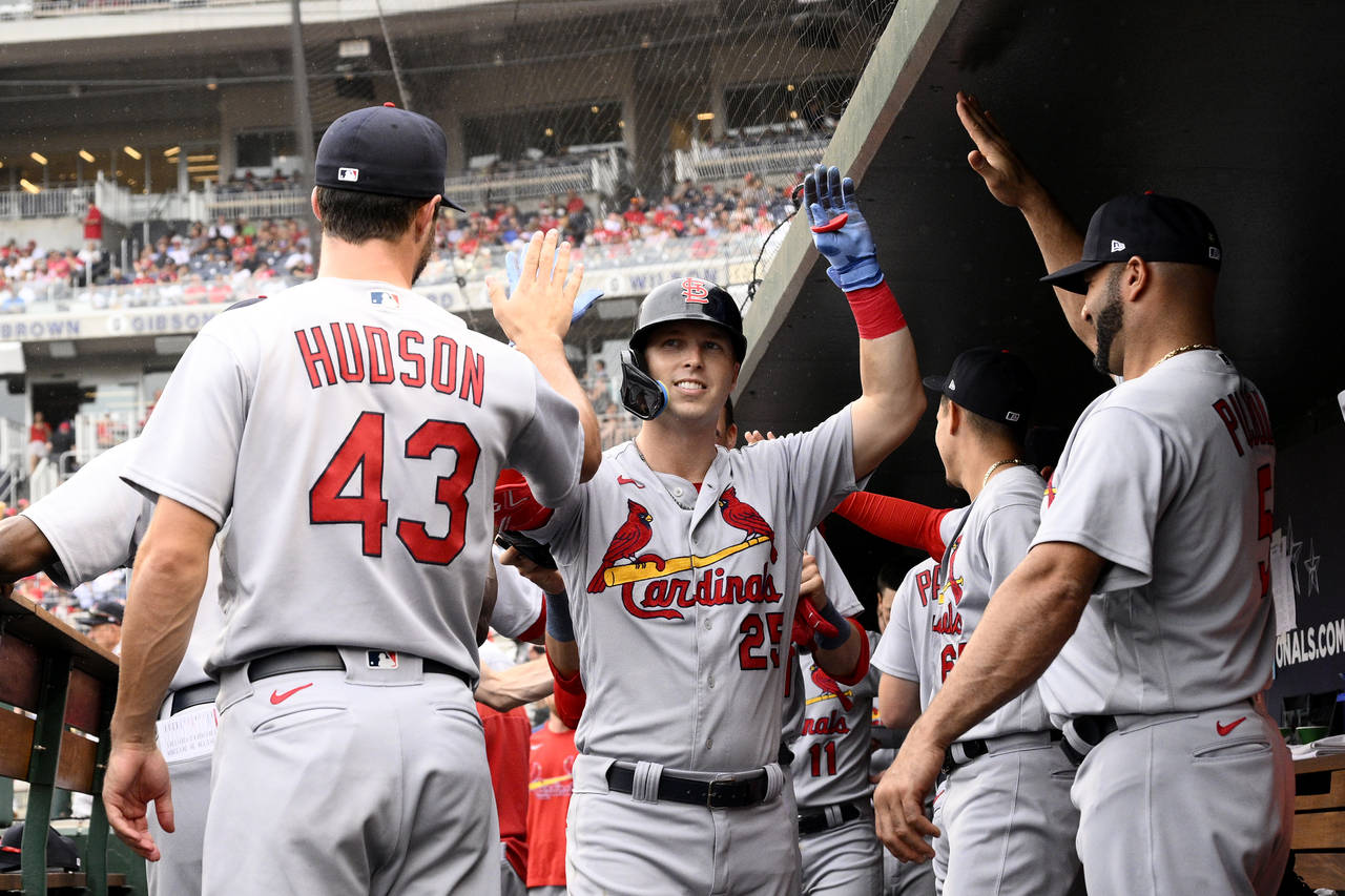 St. Louis Cardinals' Corey Dickerson (25) celebrates his three-run home run with Albert Pujols, rig...