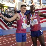 
              Gold medalist Grant Holloway, of the United States, right, poses with silver medalist Trey Cunningham, of the United States, after a final in the men's 110-meter hurdles the at the World Athletics Championships on Sunday, July 17, 2022, in Eugene, Ore.(AP Photo/Charlie Riedel)
            