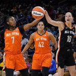
              Team Stewart's Ariel Atkins, left, and Team Wilson's Sue Bird battle for a loose ball during the first half of a WNBA All-Star basketball game in Chicago, Sunday, July 10, 2022. (AP Photo/Nam Y. Huh)
            