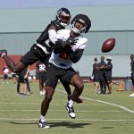 
              Atlanta Falcons safety Richie Grant (27), rear, breaks up a pass intended for tight end Kyle Pitts (8) during NFL football training camp in Flowery Branch, Ga., Friday, July 29, 2022. (Jason Getz/Atlanta Journal-Constitution via AP)
            