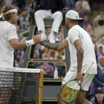 
              Australia's Nick Kyrgios shakes hands at the net with Greece's Stefanos Tsitsipas after winning their third round men's singles match on day six of the Wimbledon tennis championships in London, Saturday, July 2, 2022. (AP Photo/Kirsty Wigglesworth)
            