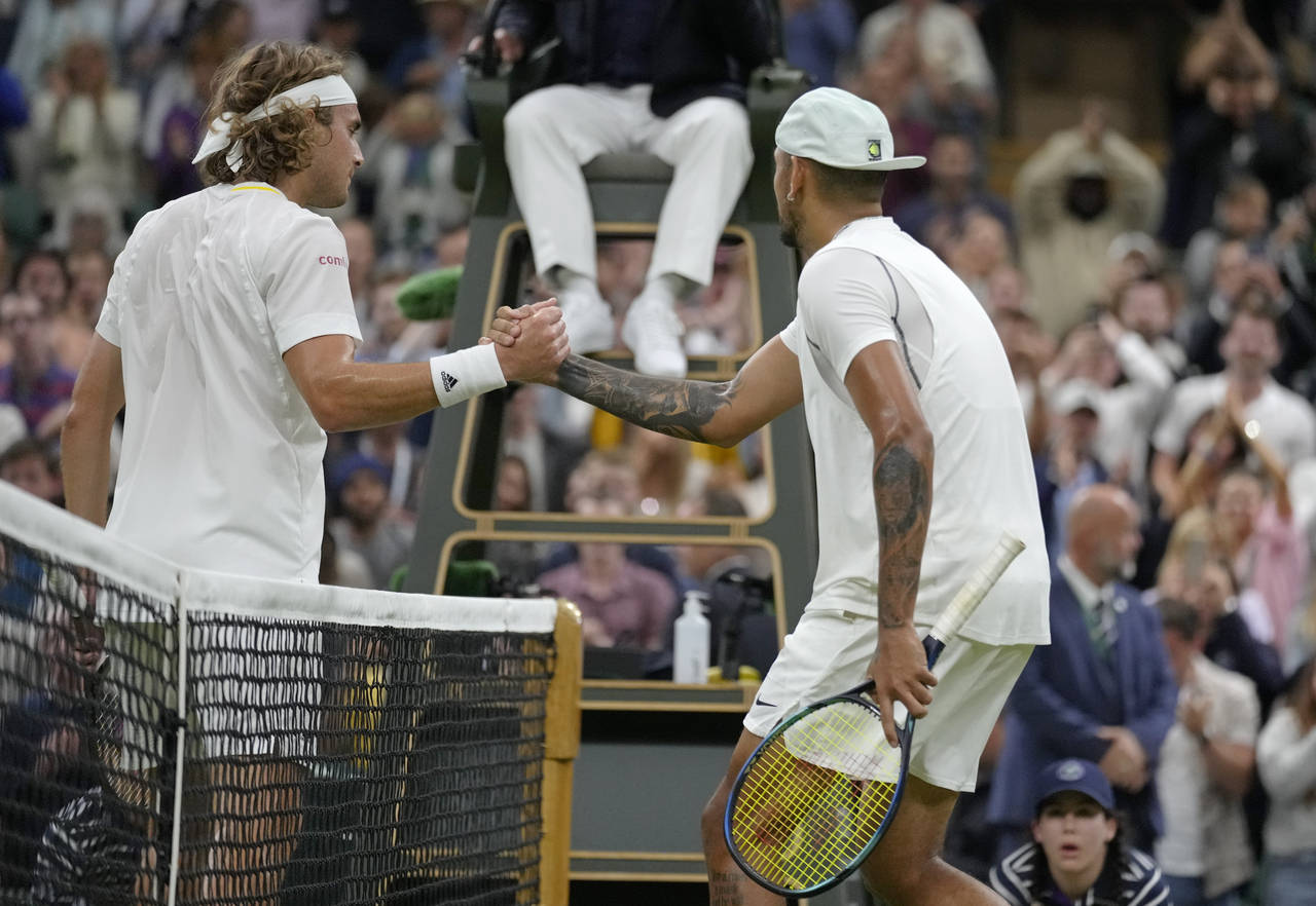 Australia's Nick Kyrgios shakes hands at the net with Greece's Stefanos Tsitsipas after winning the...