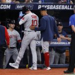 
              Boston Red Sox manager Alex Cora, right, walks the Red Sox's Trevor Story off the field against the Tampa Bay Rays during the fifth inning of a baseball game Tuesday July 12, 2022, in St. Petersburg, Fla. (AP Photo/Scott Audette)
            