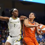 
              Connecticut Sun center Brionna Jones (42) looks to shoot against Dallas Wings center Teaira McCowan (7) during the first half of a WNBA basketball game in Arlington, Texas, Tuesday, July 5, 2022. (AP Photo/LM Otero)
            