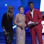 
              Lil Wayne, from left, gymnast Sunisa Lee and John Boyega present the award for best team at the ESPY Awards on Wednesday, July 20, 2022, at the Dolby Theatre in Los Angeles. (AP Photo/Mark Terrill)
            