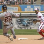 
              Chicago White Sox shortstop Leury Garcia turns the double play on Detroit Tigers' Victor Reyes (22) during the fifth inning of a baseball game, Sunday, July 10, 2022, in Chicago. (AP Photo/Mark Black)
            