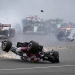 
              Alfa Romeo driver Guanyu Zhou of China crashes at the start of the British Formula One Grand Prix at the Silverstone circuit, in Silverstone, England, Sunday, July 3, 2022. (AP Photo/Frank Augstein)
            