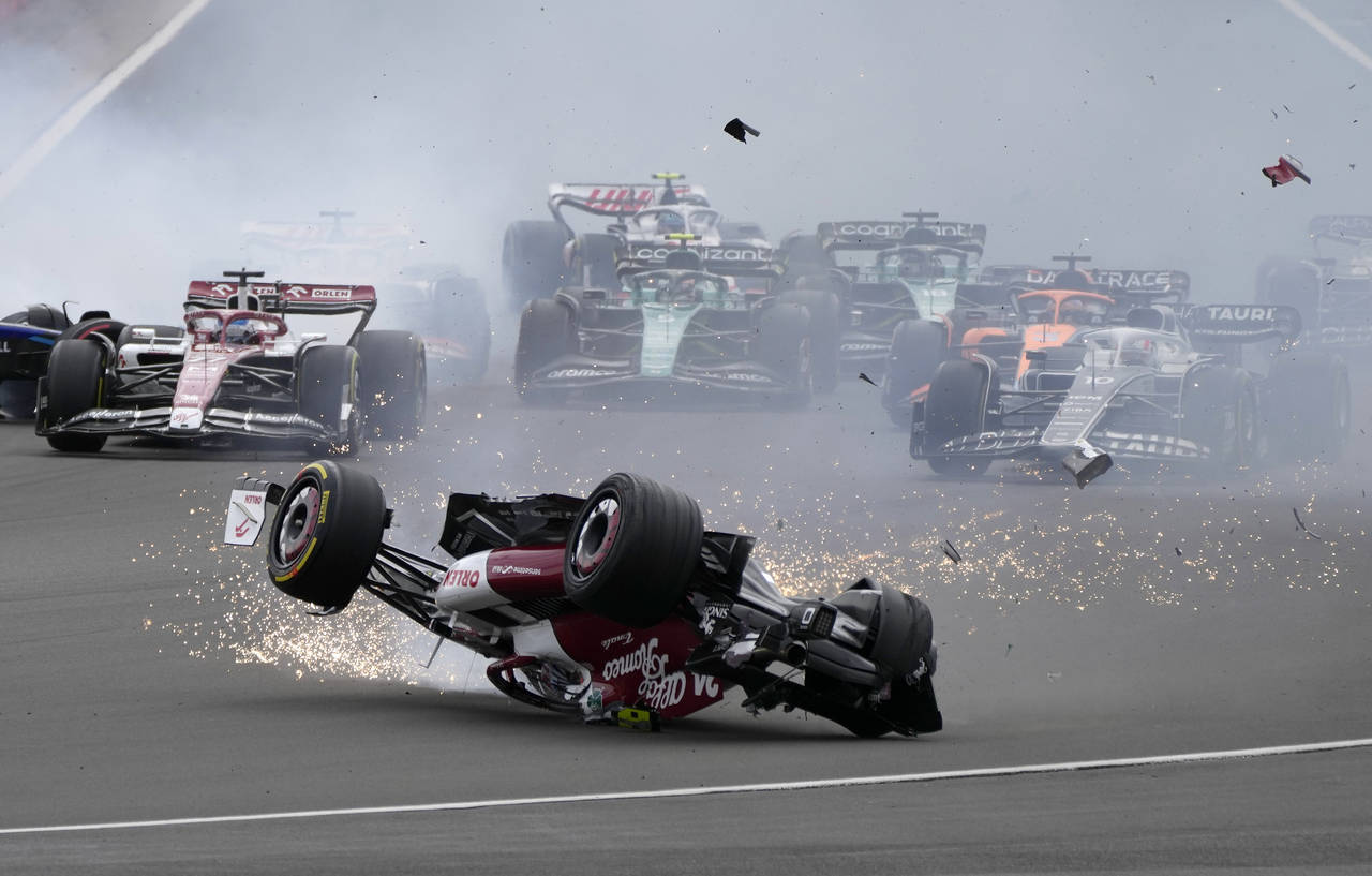 Alfa Romeo driver Guanyu Zhou of China crashes at the start of the British Formula One Grand Prix a...