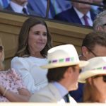 
              Melinda French Gates, center, sits in the Royal Box on Centre Court to watch Serbia's Novak Djokovic and Britain's Cameron Norrie in a men's singles semifinal on day twelve of the Wimbledon tennis championships in London, Friday, July 8, 2022. (AP Photo/Alastair Grant)
            